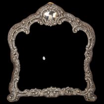 An Edwardian silver-fronted dressing table mirror, Henry Matthews, Birmingham 1903, relief