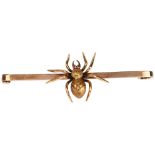 An Edwardian ruby figural spider bar brooch, circa 1910, unmarked gold set en tremblant with