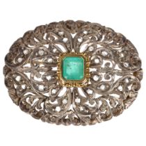 An emerald and diamond oval bombe brooch, unmarked gold and silver settings with central emerald