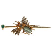 A 19th century gem set bug bar brooch, unmarked gilt-metal settings with cats eye chrysoberyl