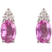 A pair of 18ct white gold pink sapphire and diamond earrings, claw set with oval mixed-cut sapphires