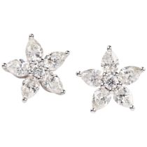 A pair of 18ct white gold diamond flowerhead earrings, claw set with modern round brilliant and