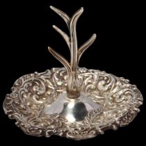 An Edwardian silver dressing table ring tree, Henry Matthews, Birmingham 1903, relief embossed