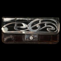 An Edwardian silver-mounted green crocodile leather purse, Charles Penny Brown, Birmingham 1904,