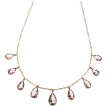 An Edwardian 9ct gold graduated amethyst fringe necklace, collet set with pear-cut amethysts, on