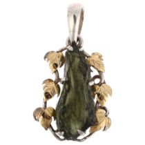 A modern sterling silver and 18ct white gold moldavite floral pendant, 44.3mm, 8.4g No damage or