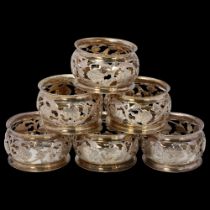 A set of 6 George V silver napkin rings, Jones & Crompton, Chester 1911, pierced and engraved