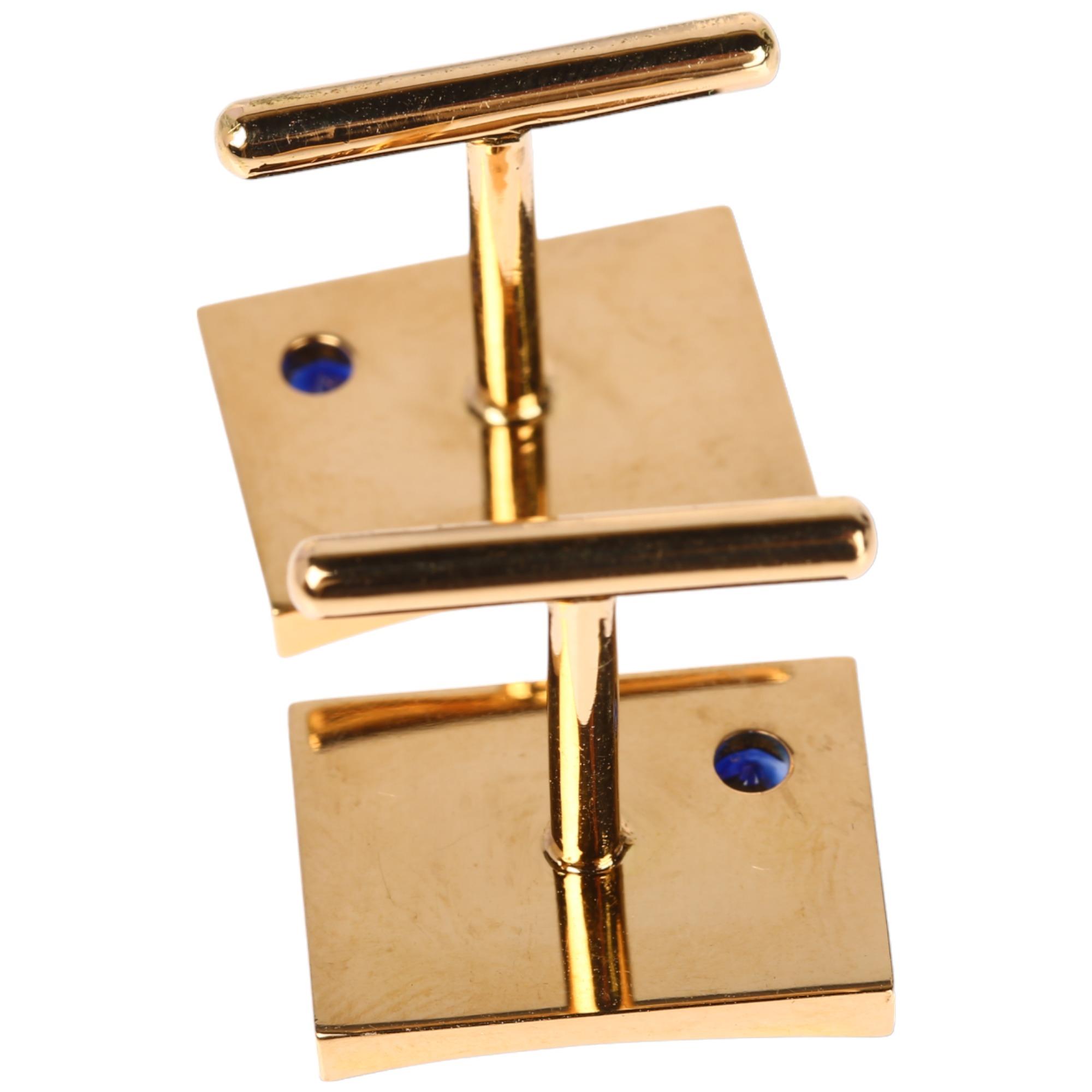 A pair of Ceylon sapphire cufflinks, by Vogue Jewellers Ltd, unmarked gold settings with rectangular - Image 3 of 4