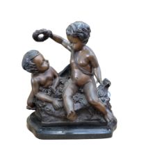 A patinated spelter group of 2 cherubs, on a shaped marble base, H50cm Good overall condition,