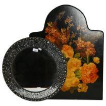 A modern circular wall mirror, and an ebonised fire screen with floral decoupage decoration, H72cm