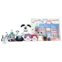 A group of Wallace and Gromit figures, including a boxed playhouse