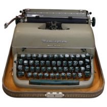 A Remington Quiet-Riter typewriter cased