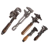 A group of early 20th century wrenches, including an Acme made in USA with twist handle, 4 with