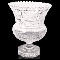 A large cut-glass campana-shaped glass centrepiece vase on star-cut octagonal base, probably early