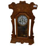 An American gingerbread mantel clock, 8-day movement, complete with key and pendulum, H64cm, working
