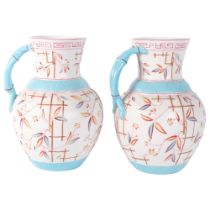 A pair of Victorian Staffordshire Aesthetic Movement wash jugs, with moulded and painted decoration,