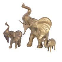 A graduated set of 3 brass trumpeting elephants, 33cm