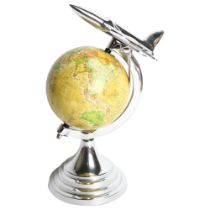 A small table-top terrestrial globe, surmounted by a jet, H31cm