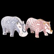 A porcelain hippopotamus and a rhinoceros, with stamp dated 2004 to the underside, in the style of