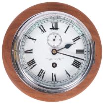 A chrome-cased ship's bulkhead clock, 8-day movement, white enamel dial and Roman numerals with