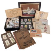 A group of Vintage cigarette cards, various albums and loose cards, and a small framed still life