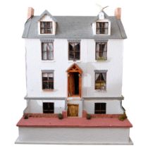 A large and impressive hand-built doll's house, Victorian style townhouse spread over 4 levels, with