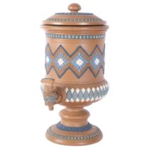 A Doulton Silicone Ware water filter, with embossed and painted decoration, with cover and