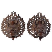 A pair of ornate patinated cast-brass mythical beast wall sconces, H16cm