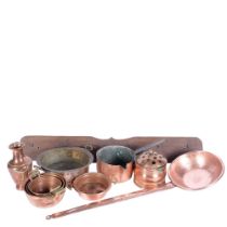 A long-handled copper pan, 77cm, a copper milk pan, and coat hooks, copper pots, colander etc