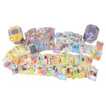 POKEMON - a quantity of Pokemon trading card game loose cards, in associated collector's tins