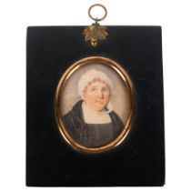 A 19th century oval miniature, watercolour on paper, study of a lady in a bonnet, framed, given as a