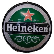 "Heineken", a large double-sided circular illuminated advertising sign for Heineken, on stand, H97cm