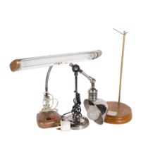 An adjustable polished metal desk lamp, a flexible stem desk lamp with florescent bulb, and a stand,