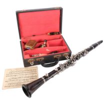 A Boosey & Hawkes Regent clarinet, in fitted case, with associated accessories and cleaning