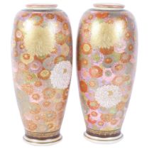 A pair of Japanese pottery vases, with enamelled and gilded millefiori decoration, signed, H25cm