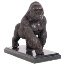 A bronze sculpture of a gorilla, on a marbled base, H18.5cm