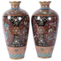 A pair of Oriental cloisonne vases, with bird of paradise and floral decoration, 31cm