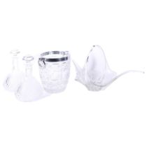 A heavy glass ice bucket with ring handles, 22cm, a pair of moulded glass decanters and stoppers,