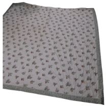 A Vintage machine woven bedspread, with floral decoration, and green foliate outer edge, 101cm x