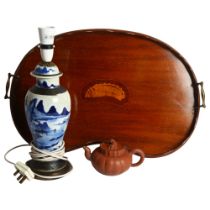 An Edwardian mahogany kidney-shaped 2-handled tea tray, W59cm, a Chinese blue and white table