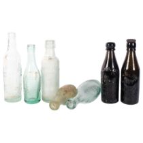 A group of aqua mineral water bottles, a Bewick Bros bottle, 20cm, and another ale bottle