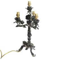 A scrolled wrought-iron 4-branch table lamp, decorated with acanthus leaf and roses, height to top