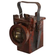 A Second World War Period railway lantern, with partial paint residue, marked with H 1943, and