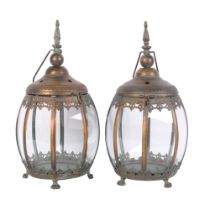 A pair of small copper lanterns, with glass panels, height 40cms.