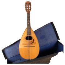 A mandolin in fitted case, with inlaid butterfly decoration and sectioned back It is likely it