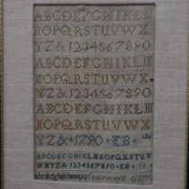 A framed George III sampler, signed with initials EB dated 1790, 29cm x 39cm overall