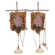 A pair of 19th century beadwork face screens, in ceramic stands, height overall 56cm