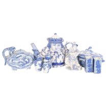 A quantity of blue and white Chinese ceramic ware, including a peg leg figural Toby jug style