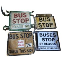 A group of early 20th century bus stop signs