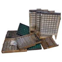 A collection of various early 20th century printer's trays